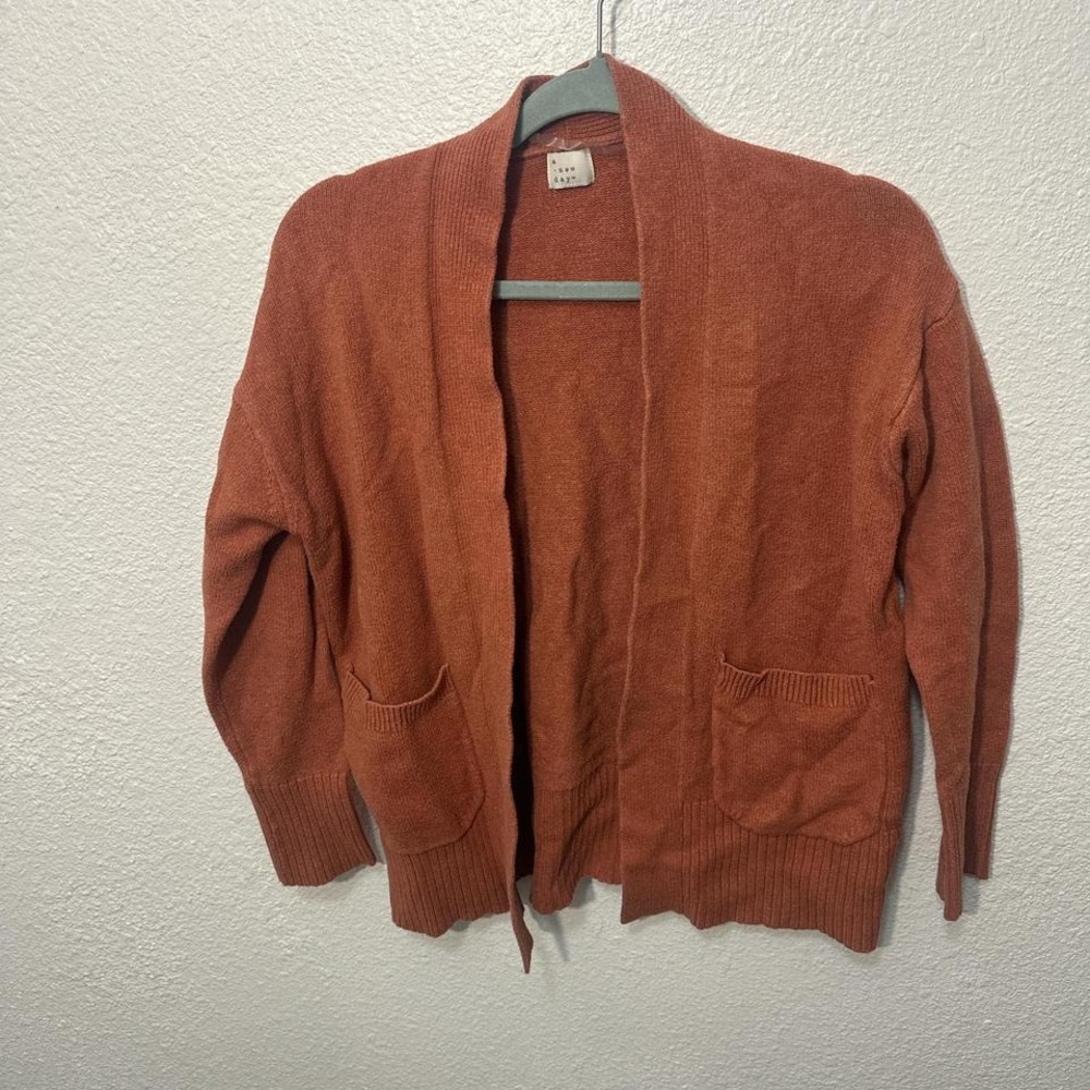 Orange cardigan with pockets
